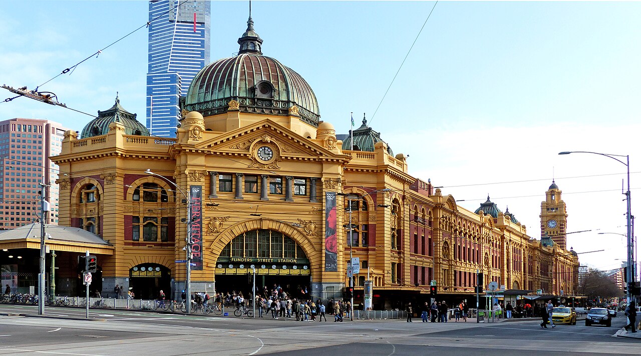 Yellow facade and green dome of Flinders Street Station in Melbourne